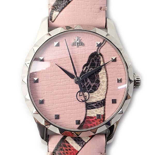 G-Timeless watch dial detail with pink face and snake illustration
