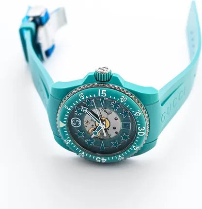 Gucci Dive 40mm aquamarine watch worn on wrist with bio-based plastic strap