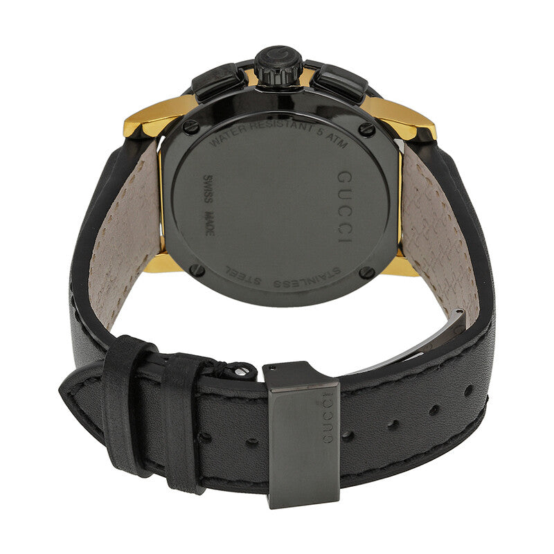 Gucci G-Chrono XL watch caseback showing black engraved case with gold-tone lugs and black leather strap