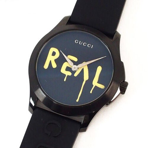 Gucci G Timeless Ghost watch worn on wrist with black rubber strap