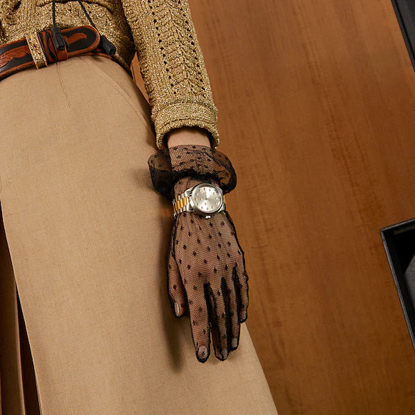 Gucci G-Timeless multibee automatic watch worn on wrist with two-tone bracelet