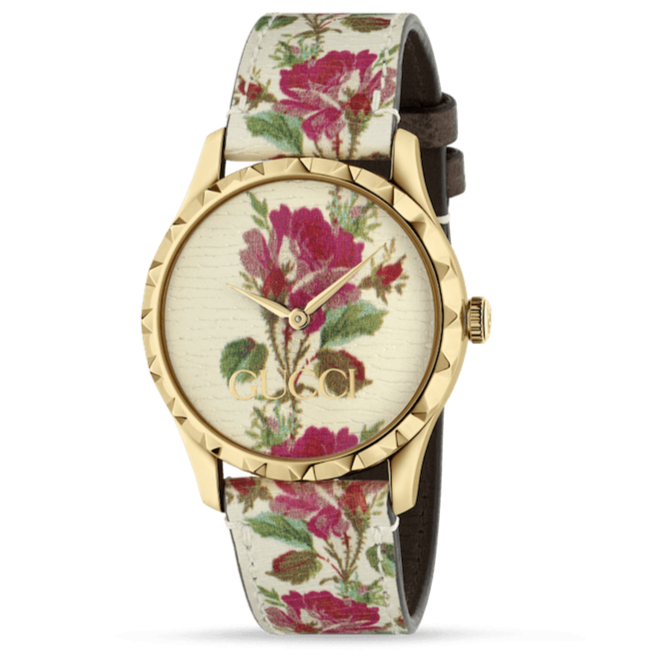 Gucci G Timeless floral watch with gold case and pink floral patterned dial