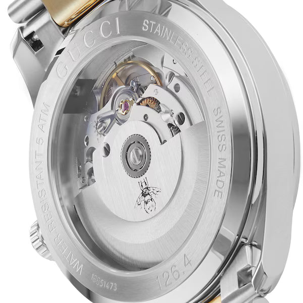 Gucci G-Timeless watch caseback showing automatic movement and stainless steel case