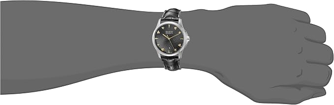 Gucci G-Timeless ladies watch worn on wrist showing black dial and proportions