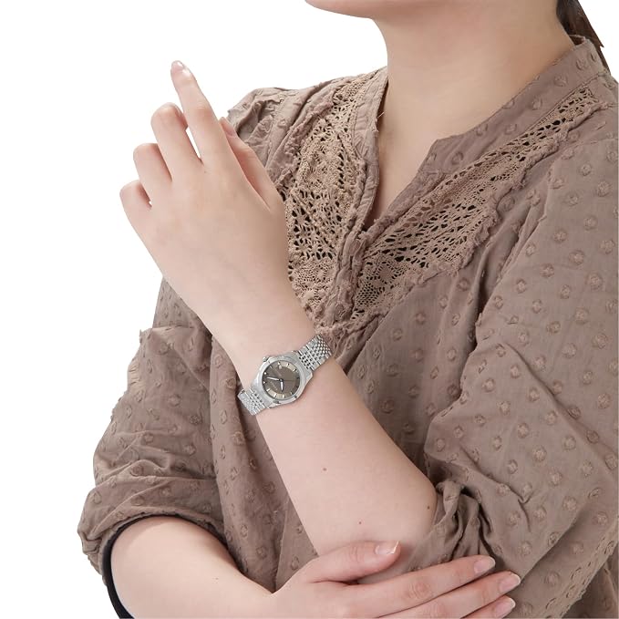 Gucci G-Timeless YA126503 watch worn on wrist with brown dial and steel bracelet