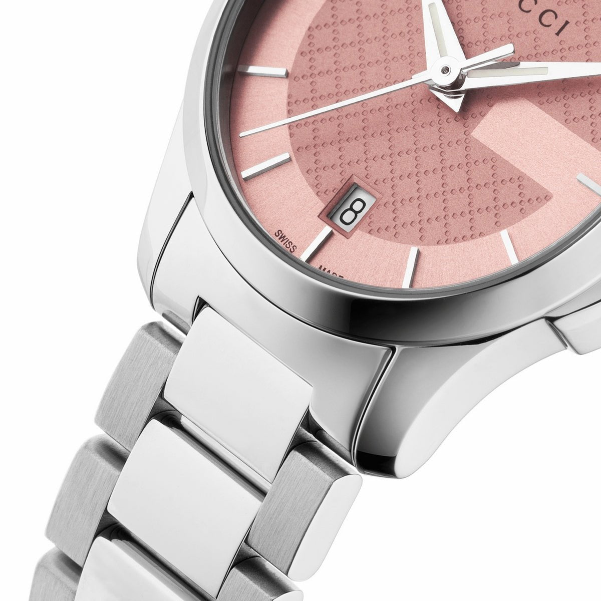Close-up of Gucci G-Timeless pink dial with quilted pattern, date window, and steel hands