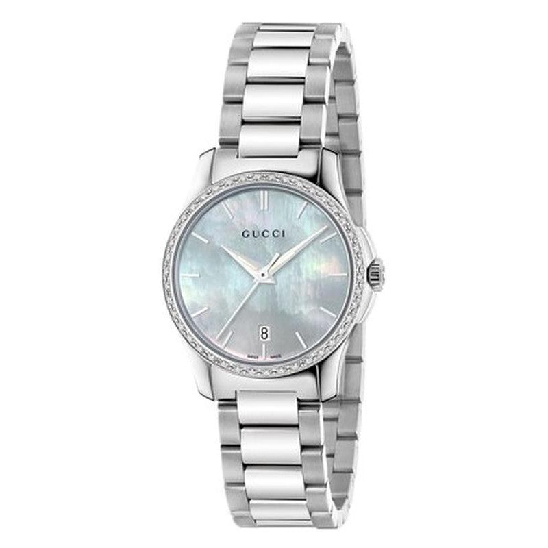 Gucci G-Timeless watch angled view showing pale blue mother-of-pearl dial and stainless steel case