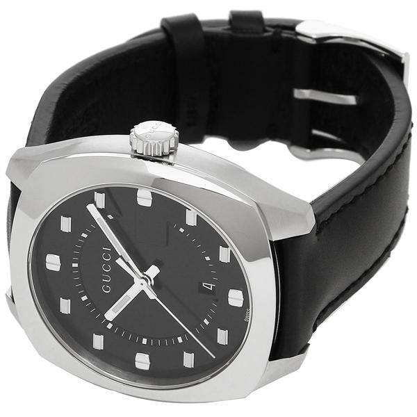Gucci GG2570 watch on wrist with black leather strap and silver case visible