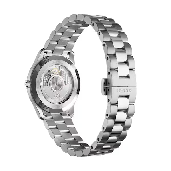 Gucci G-Timeless watch caseback showing automatic movement and stainless steel bracelet