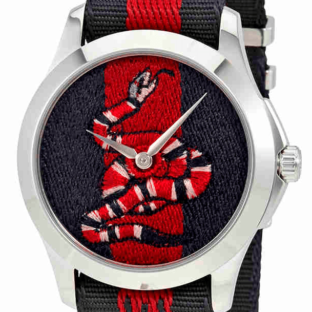 Gucci Le Marche Des Merveilles watch at angle showing red-black striped strap and case profile