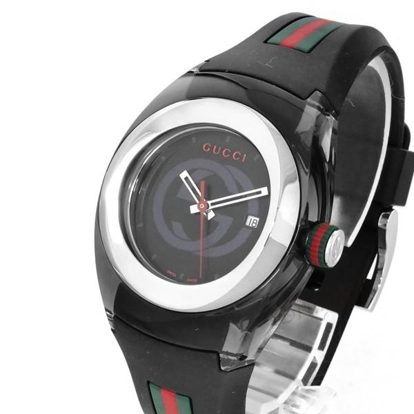 Gucci Sync watch angled view showing black dial and red-green Web stripe strap