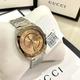 Gucci Vintage Diamonds watch on wrist showing brown dial and silver steel bracelet