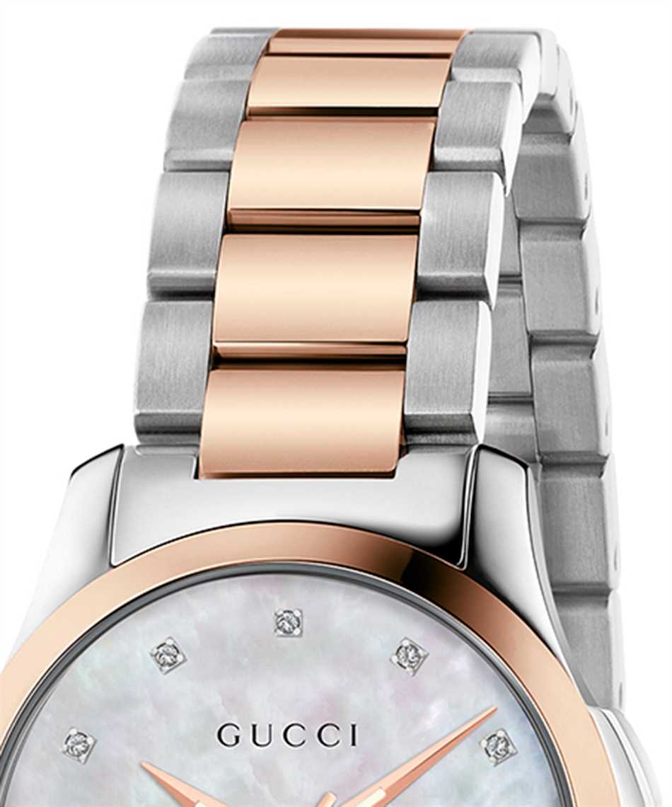 Side angle view of Gucci G Timeless watch showing two-tone steel and rose gold band