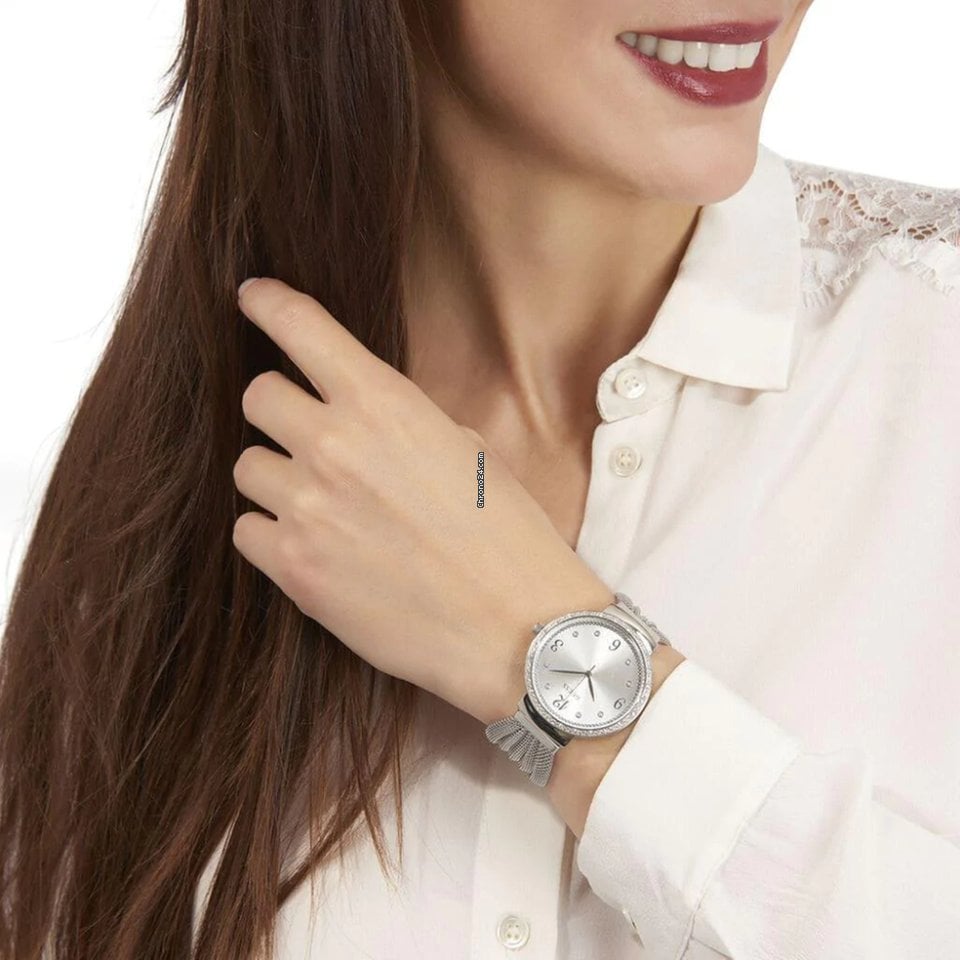 Guess Chiffon watch worn on wrist, showing silver dial and mesh strap in use