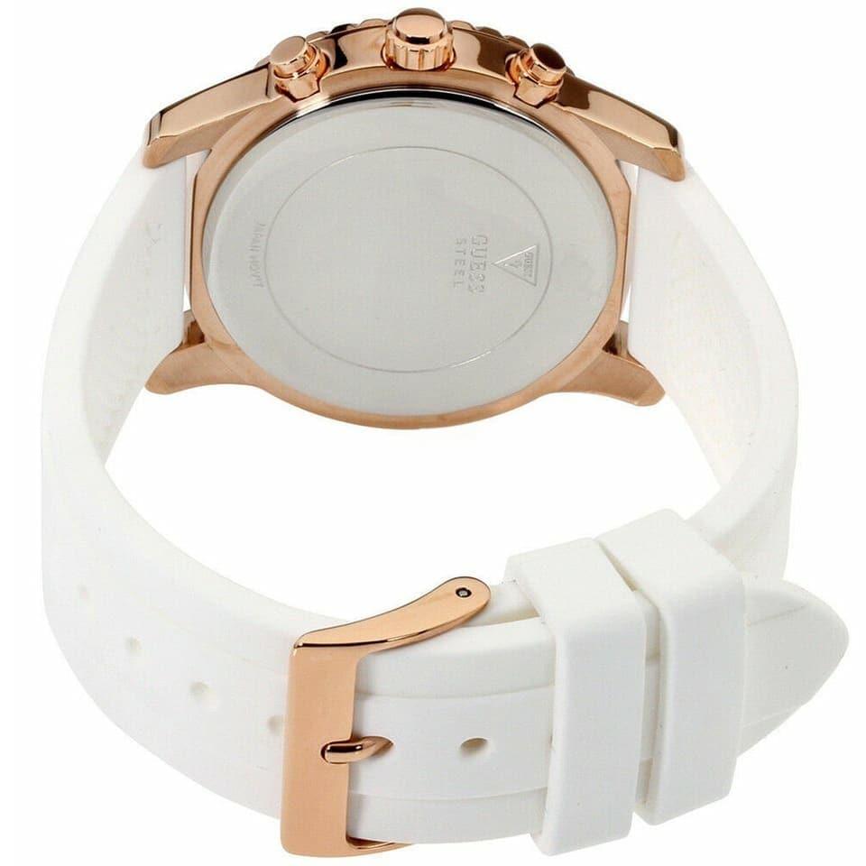 Caseback and strap view of Guess Confetti Crystal rose gold chronograph watch with white rubber strap