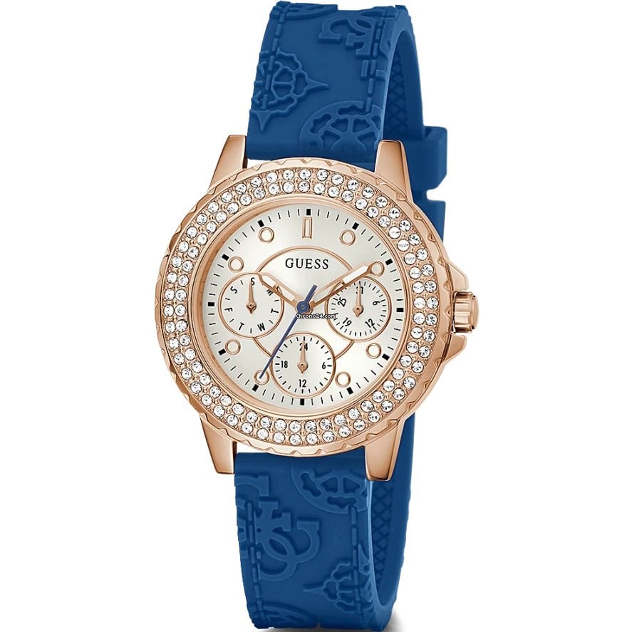 Guess Crown Jewel women's watch with rose gold case, crystal bezel, white dial, and blue silicone strap