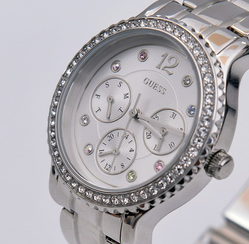 Close-up of Guess Enchanting dial showing three subdials and crystal bezel
