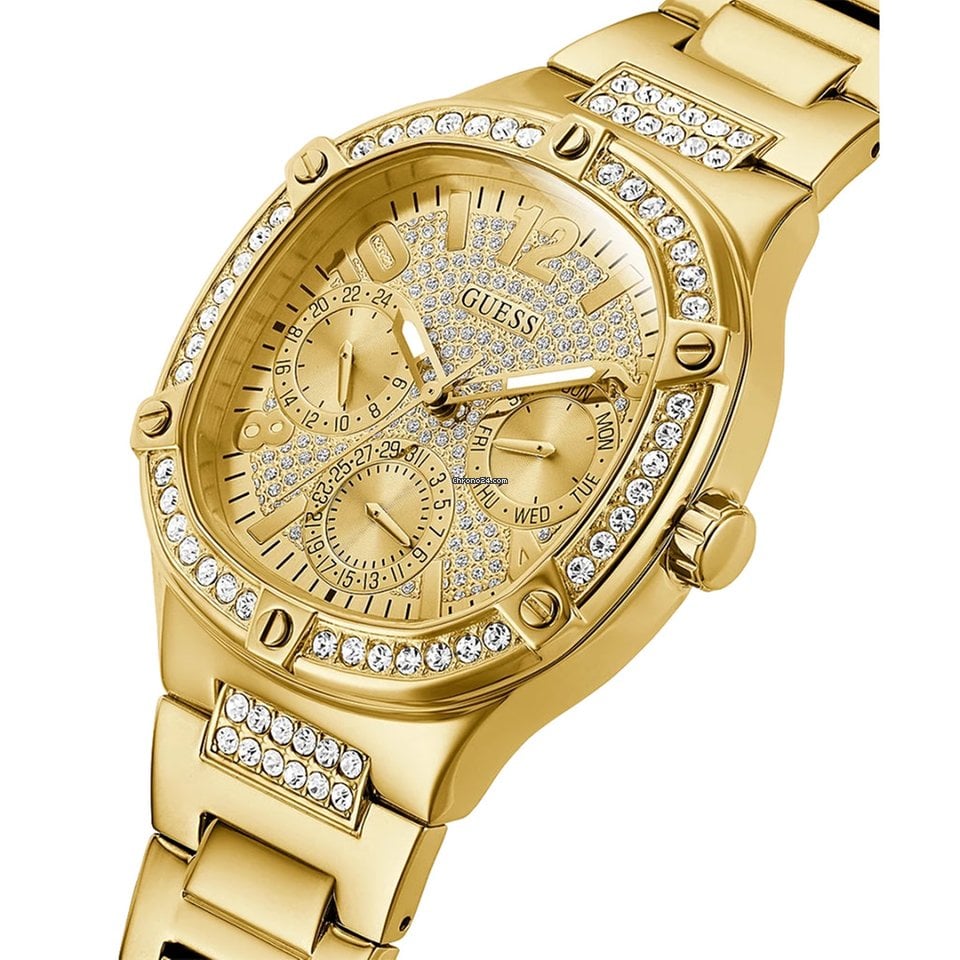 Side angle view of Guess Frontier Crystal watch showing bezel and gold bracelet