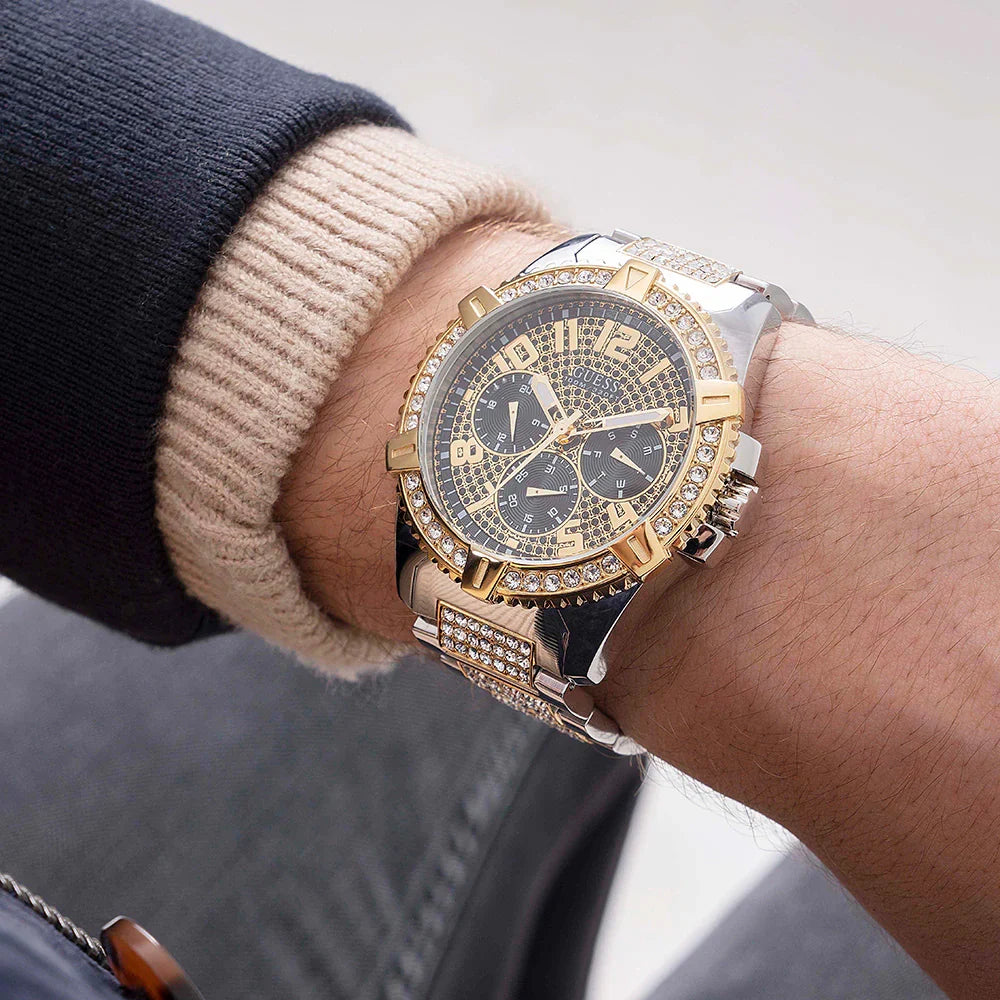 Guess Frontier two-tone chronograph watch on wrist with metal bracelet