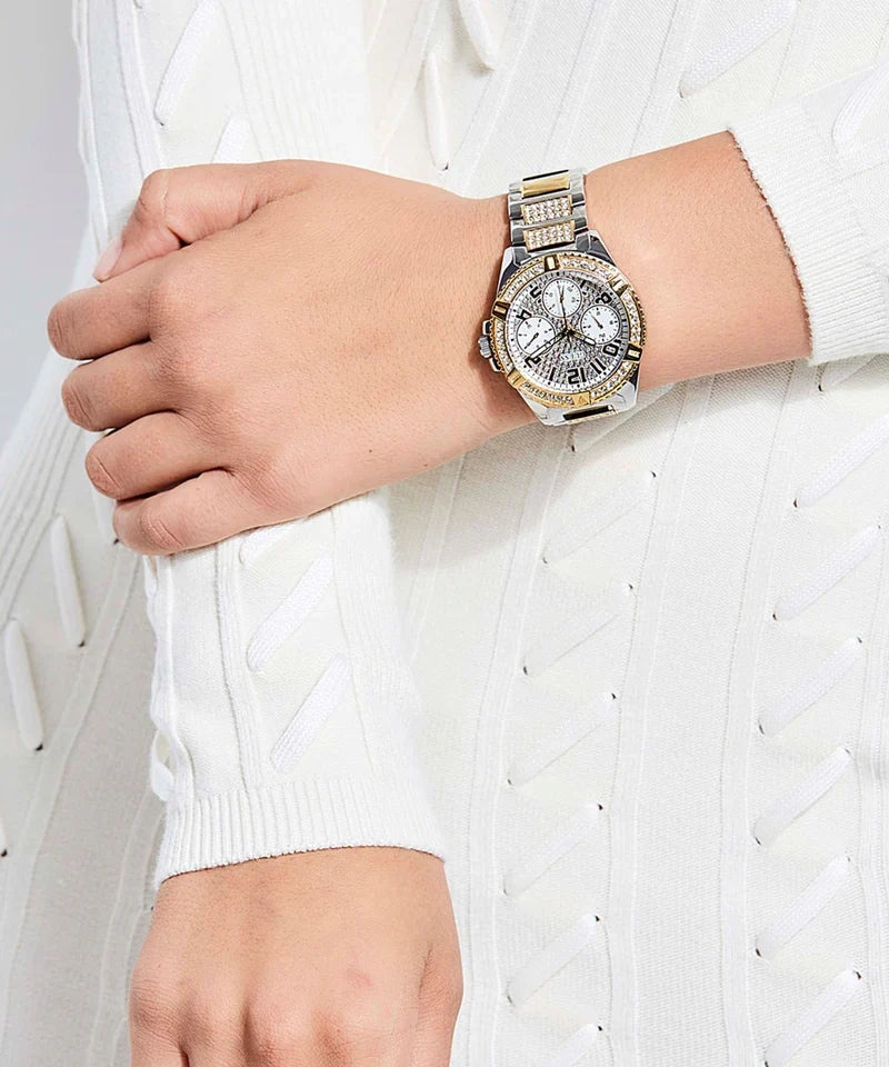Guess Frontier chronograph watch worn on wrist, showing gold dial and two-tone bracelet