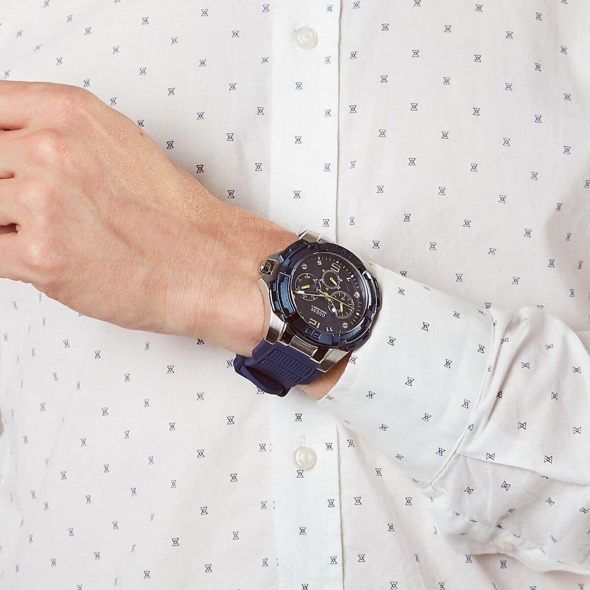 Guess Genesis blue chronograph watch worn on wrist