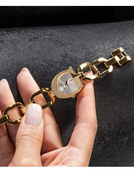 Guess Gia GW0683L2 gold watch held in hand showing detail