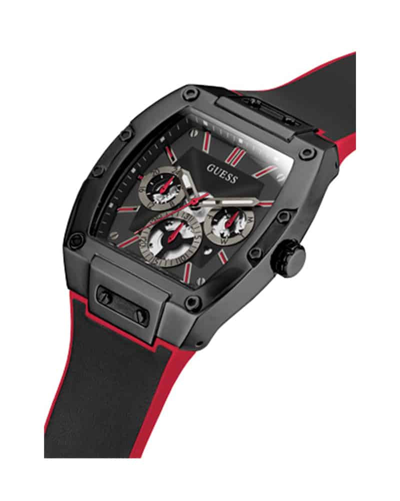 Guess Phoenix 43mm watch worn on wrist showing black case, black dial with red accents and red silicone band