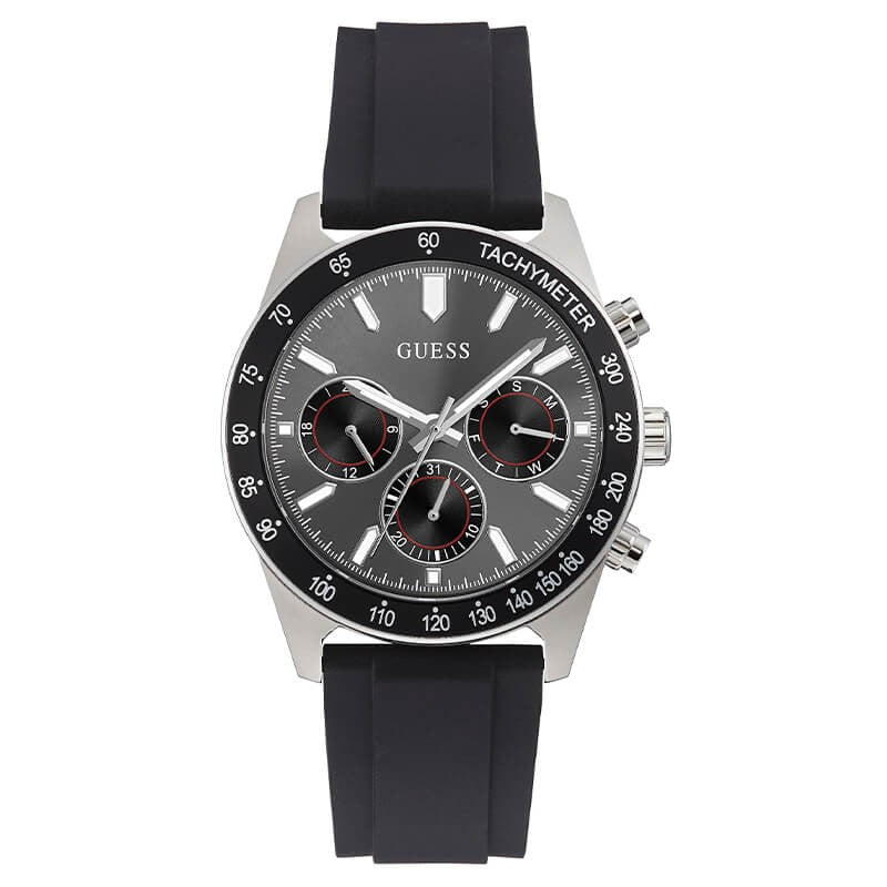 Guess silver tone chronograph watch with black silicone strap, tachymeter bezel, and three subdials on black dial