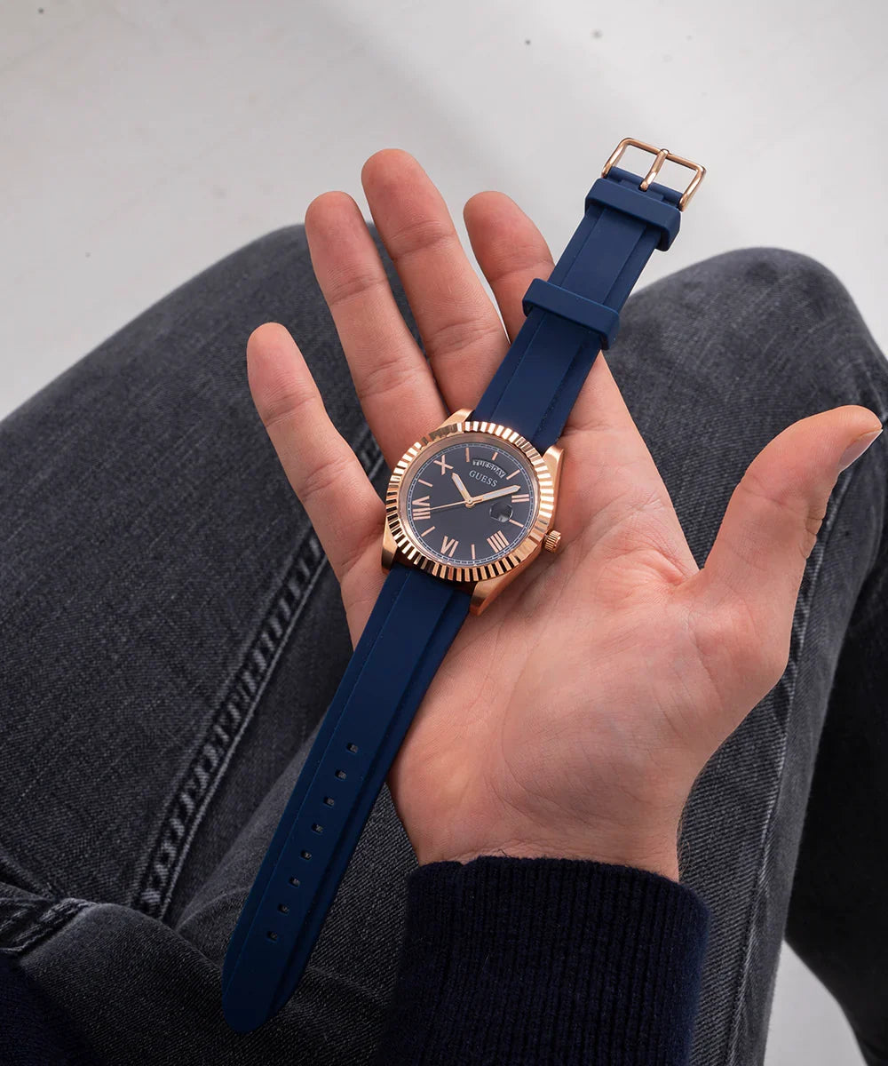 Guess GW0335G2 men's watch on wrist showing blue dial and rose gold case details