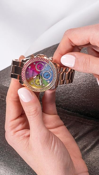 Close-up detail of GUESS watch dial showing colorful gradient sections and crystal bezel