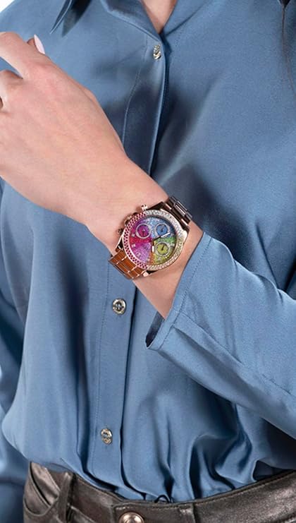 GUESS rose gold watch worn on wrist, displaying colorful dial with multiple subdials