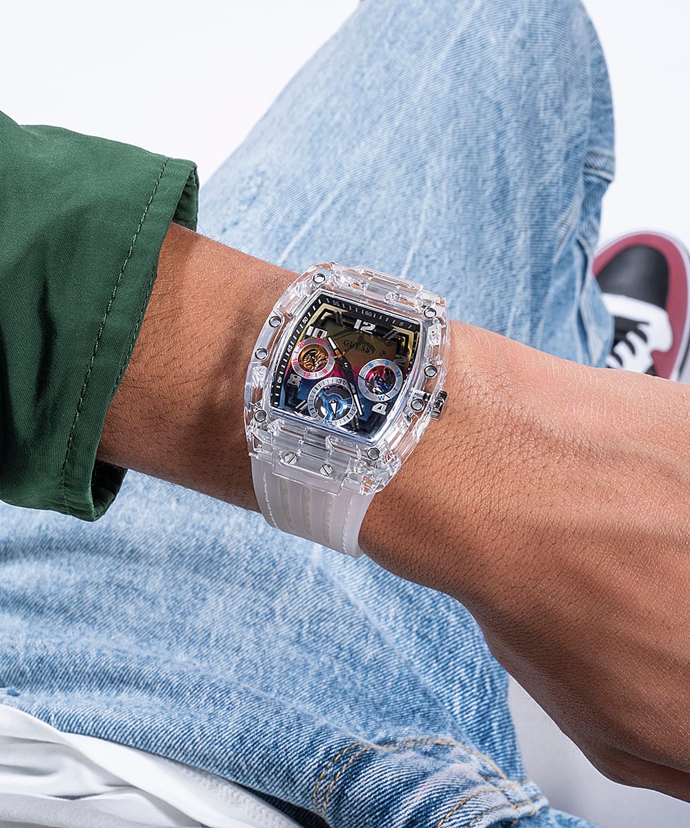 Guess GW0499G3 clear case watch worn on wrist with white silicone strap