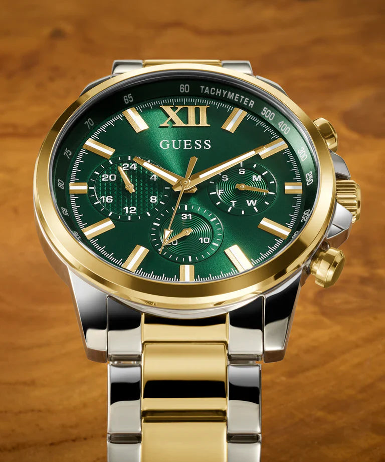 GUESS GW0900G5 dial detail with green face, gold hour markers, Roman numerals, and chronograph subdials