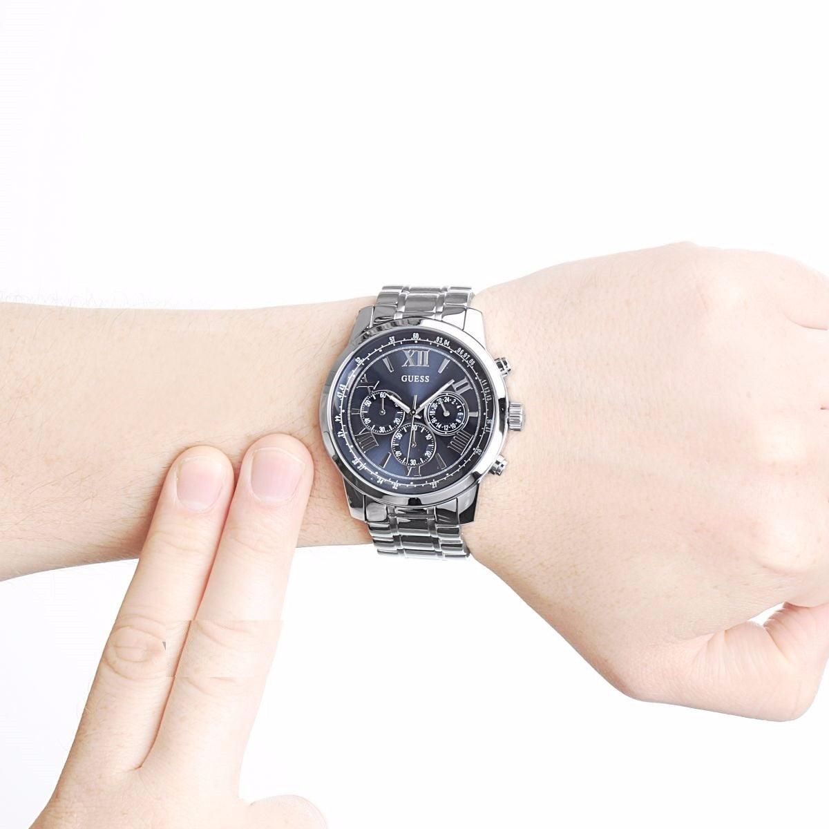 Guess Horizon chronograph with blue dial and steel bracelet worn on wrist, front view