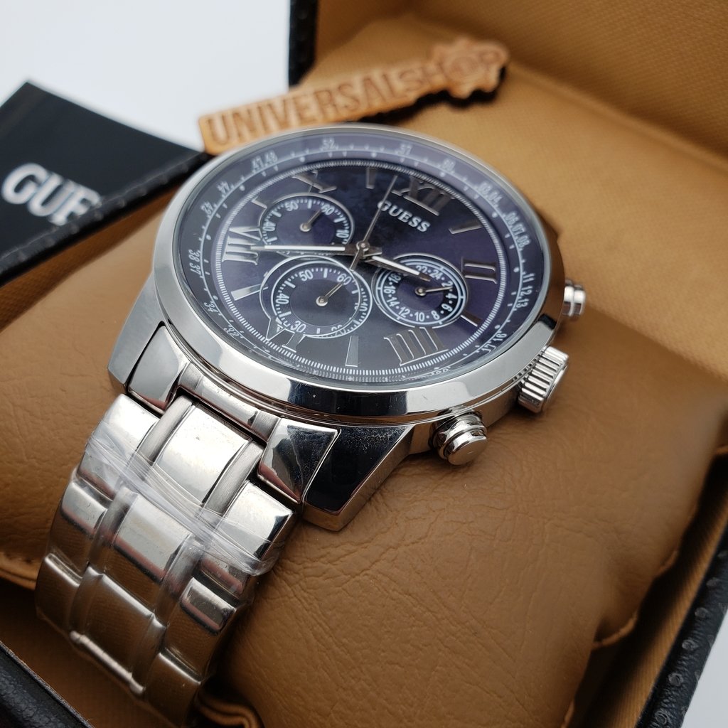 Guess Horizon chronograph watch worn on wrist showing blue dial with chronograph subdials