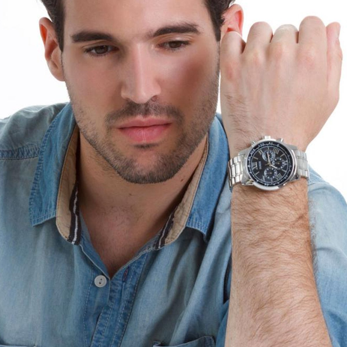 Guess Horizon chronograph watch worn on wrist with black dial and steel bracelet