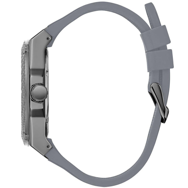 Side view of Guess Legacy watch showing gunmetal case and gray silicone strap