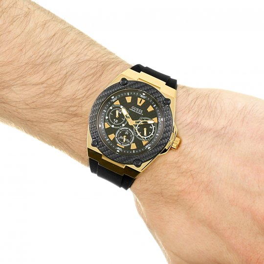 Guess Legacy men's chronograph watch worn on wrist with black rubber strap