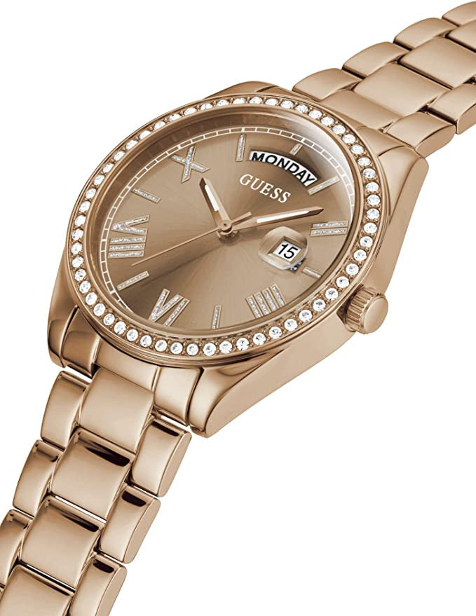 Guess Luna rose gold watch angled view showing crystal bezel and bracelet