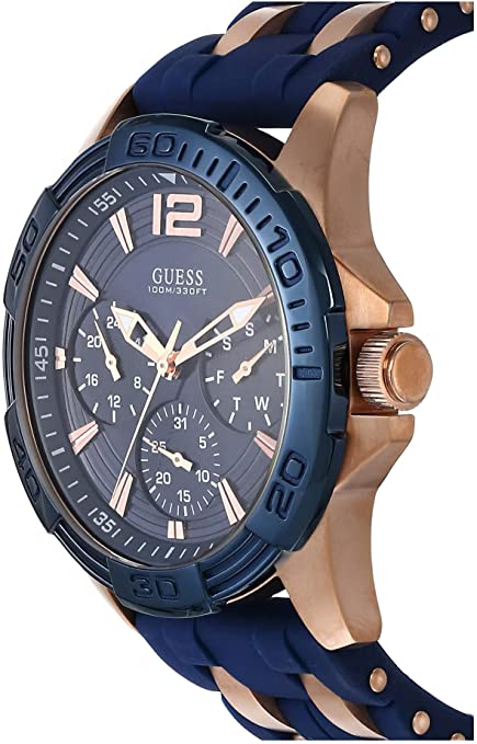 Guess Oasis watch side angle view showing blue dial and rose gold case with blue rubber strap