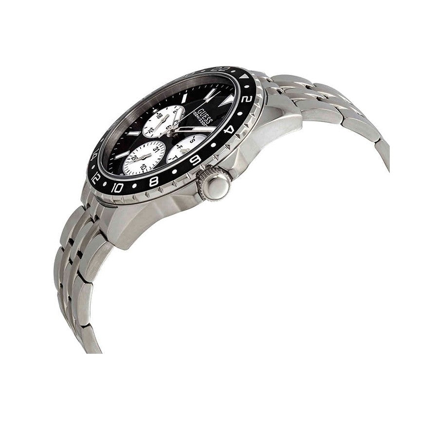 Guess Odyssey watch at angle showing black bezel, chronograph subdials, and steel bracelet
