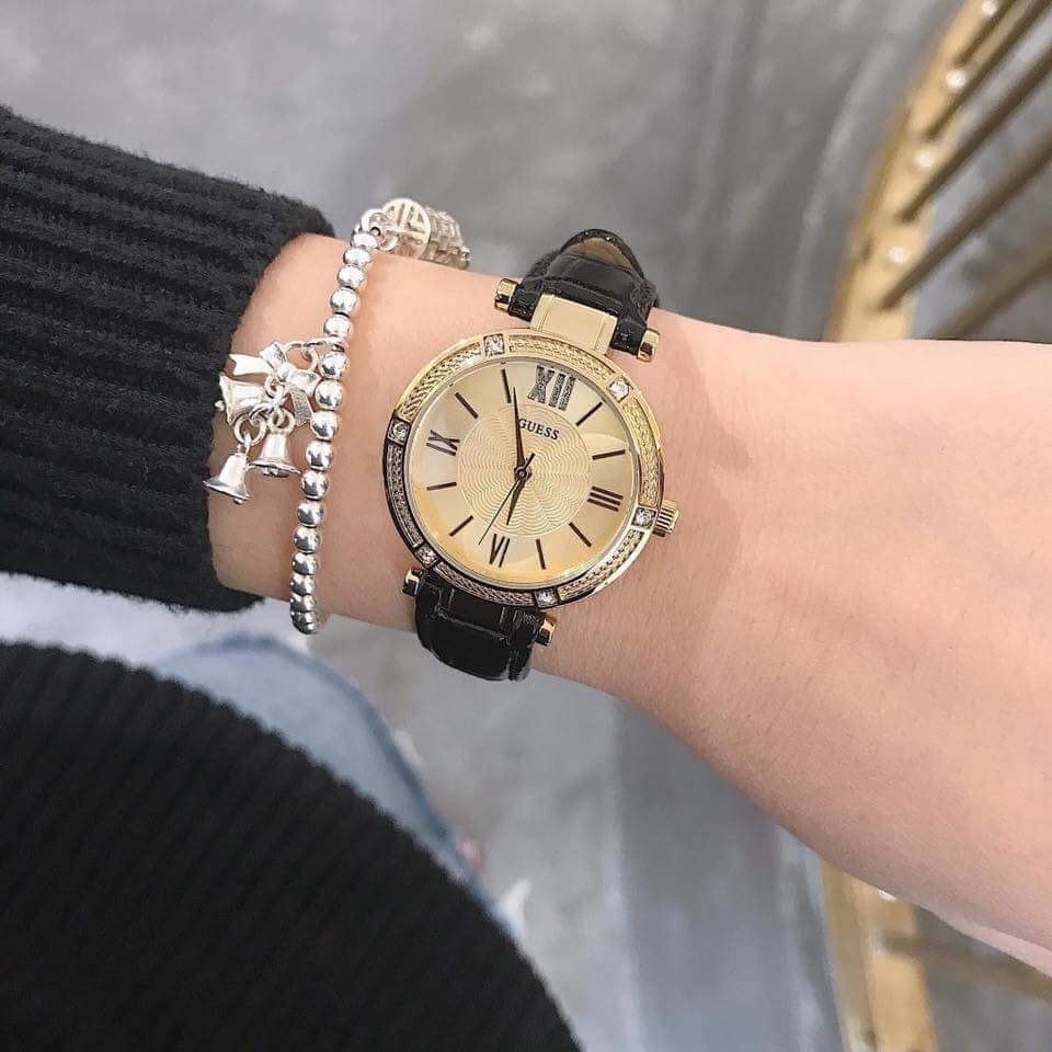 Guess Park Ave South watch on wrist with styling, black leather strap visible