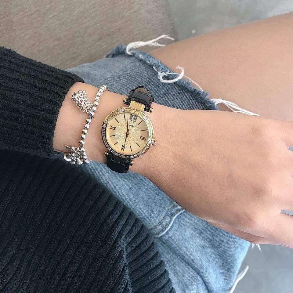 Guess Park Ave South ladies watch worn on wrist styled with bracelets