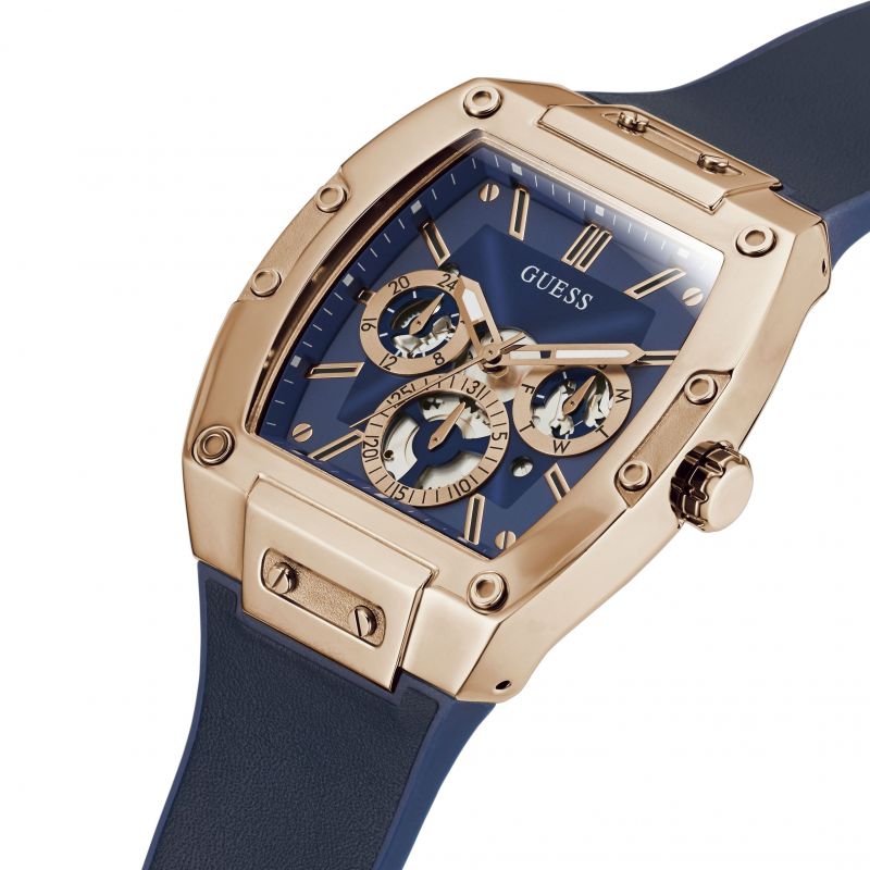 Guess Phoenix watch side angle view showing rose gold case, crown, and navy strap