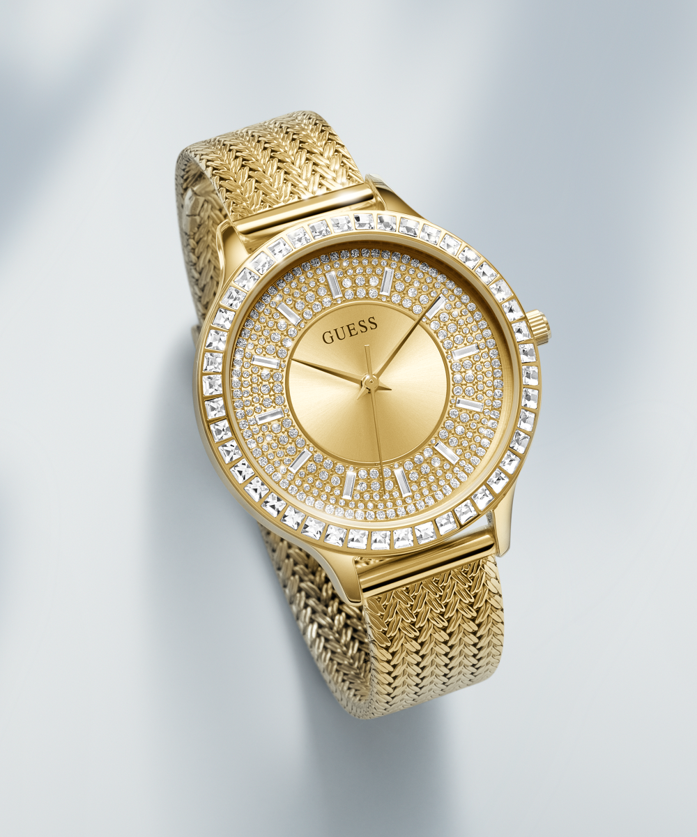 Guess Soiree watch worn on wrist showing gold mesh strap and crystal-adorned case