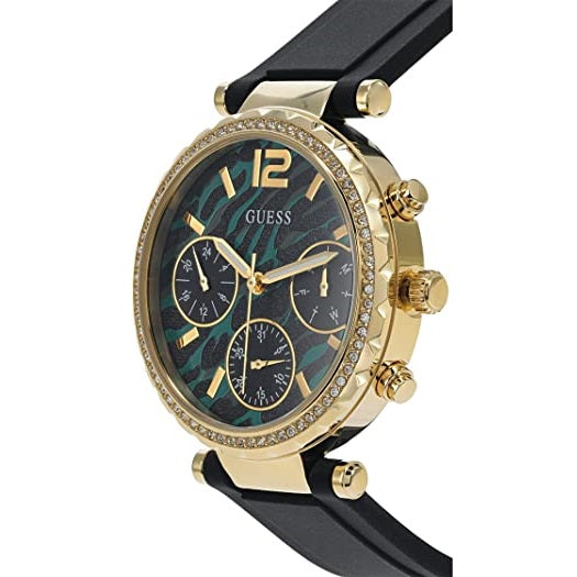 Guess Solstice watch side view showing gold-tone case with crystal-set bezel and black rubber strap