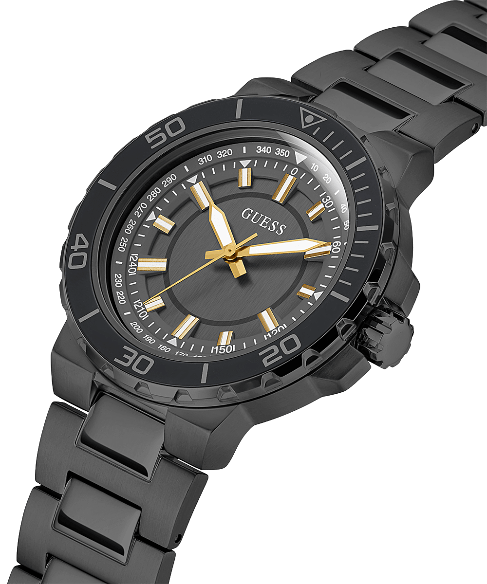 Guess Sport Diver watch at angle showing black dial, rotating bezel, and steel bracelet