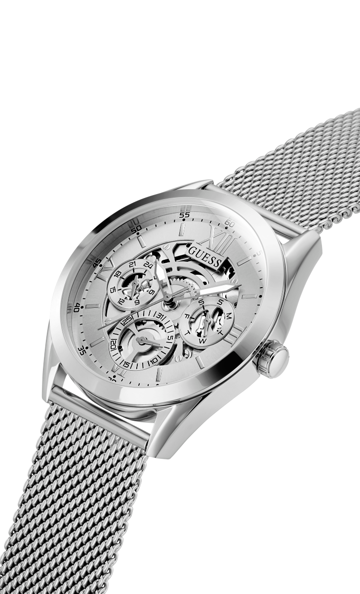 Guess Tailor watch at angle showing silver mesh strap and skeleton dial design