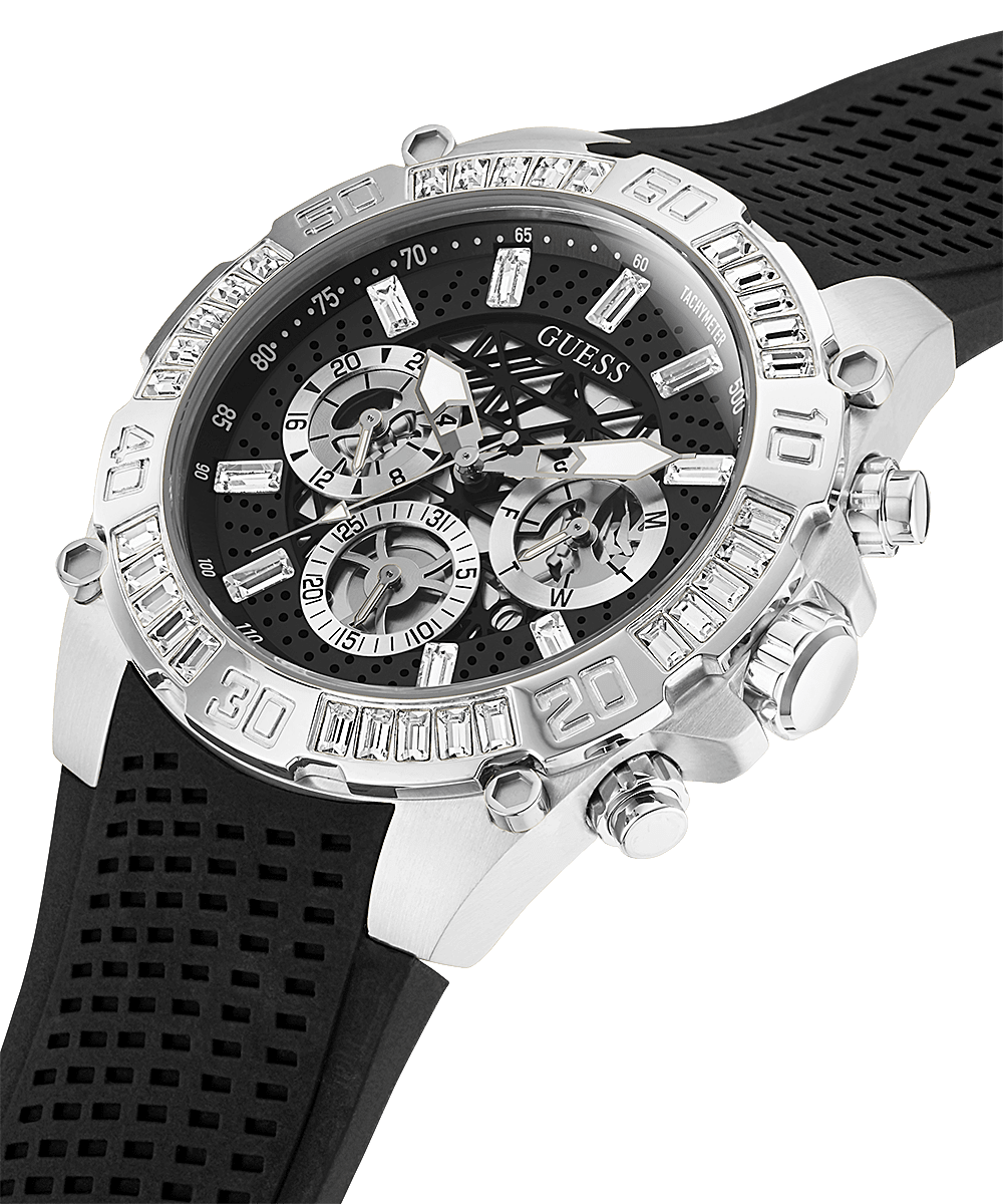 Angled view of Guess Trophy watch showing silver tone bezel and black silicone perforated strap