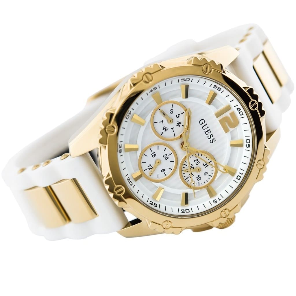 Three-quarter view of Guess chronograph watch with gold-tone case and white silicon strap